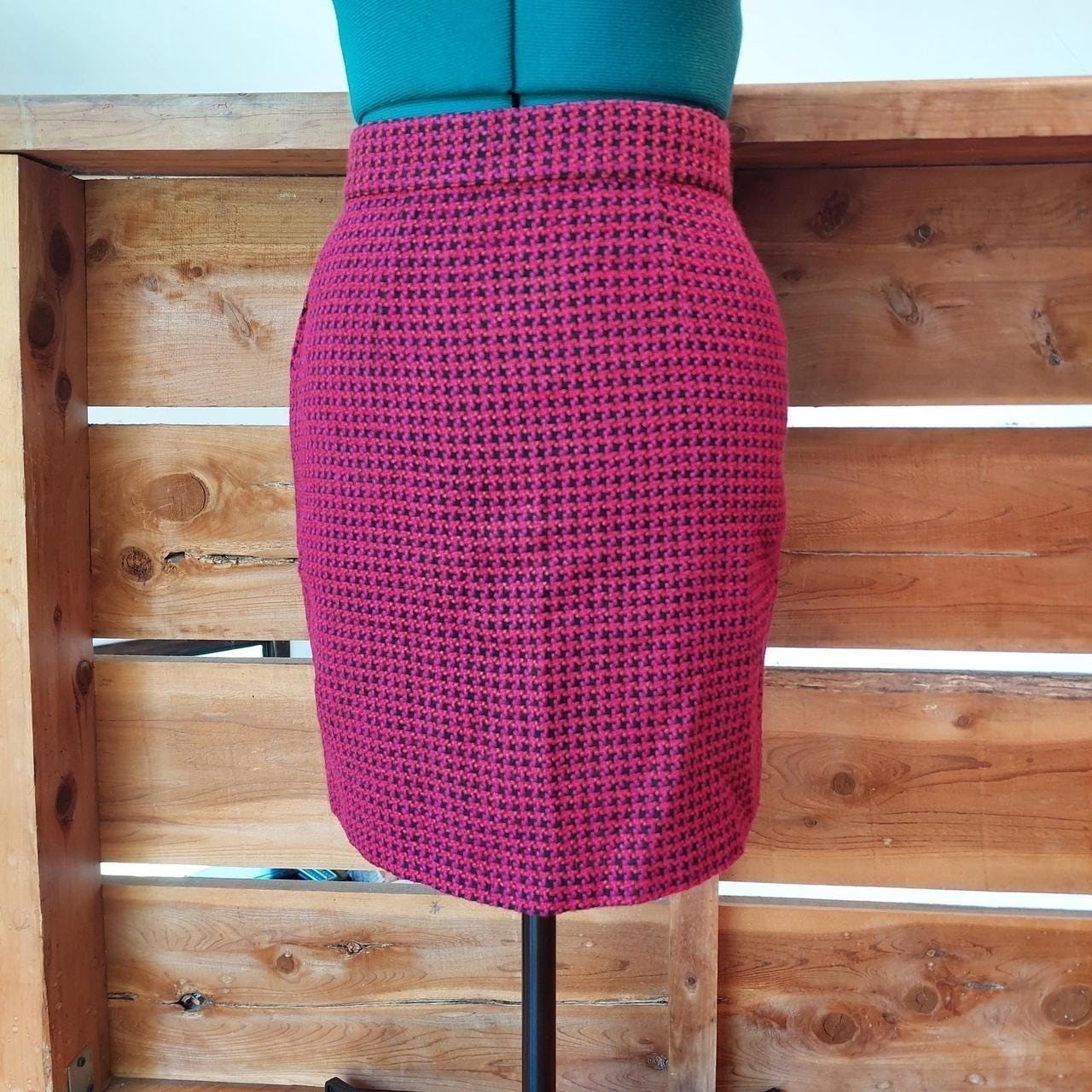 Vintage red, pink, and black houndstooth skirt with zipper and button closure.