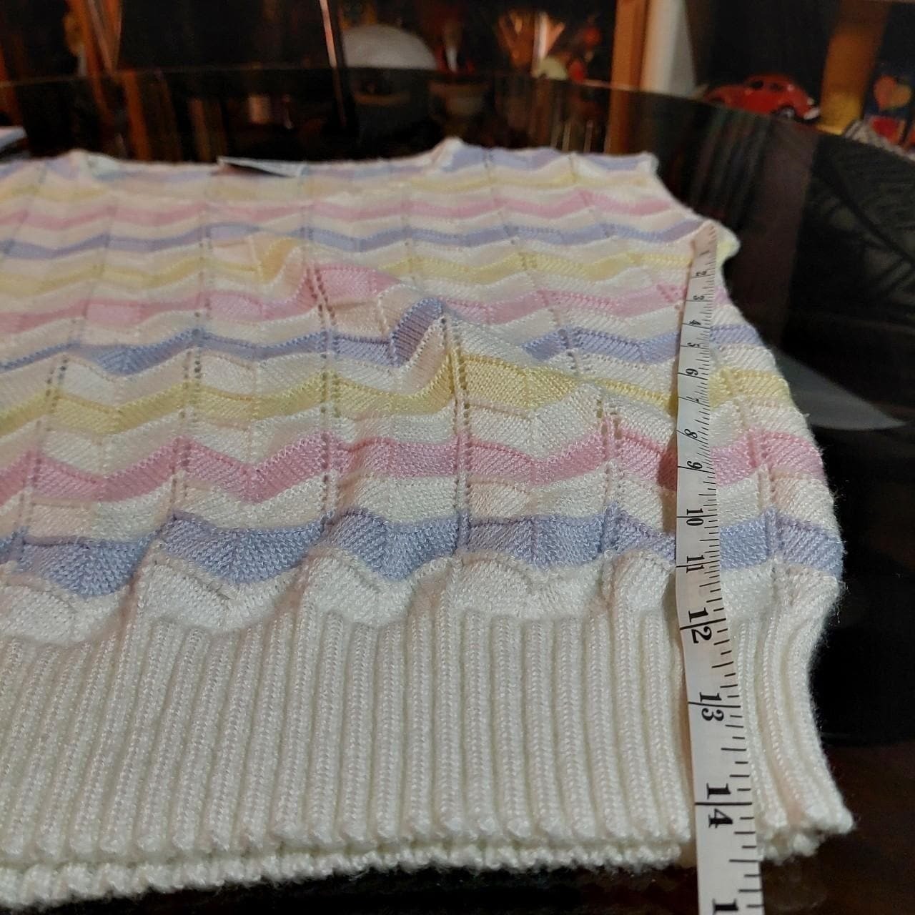 Vintage pink, yellow, purple, and white sweater vest.