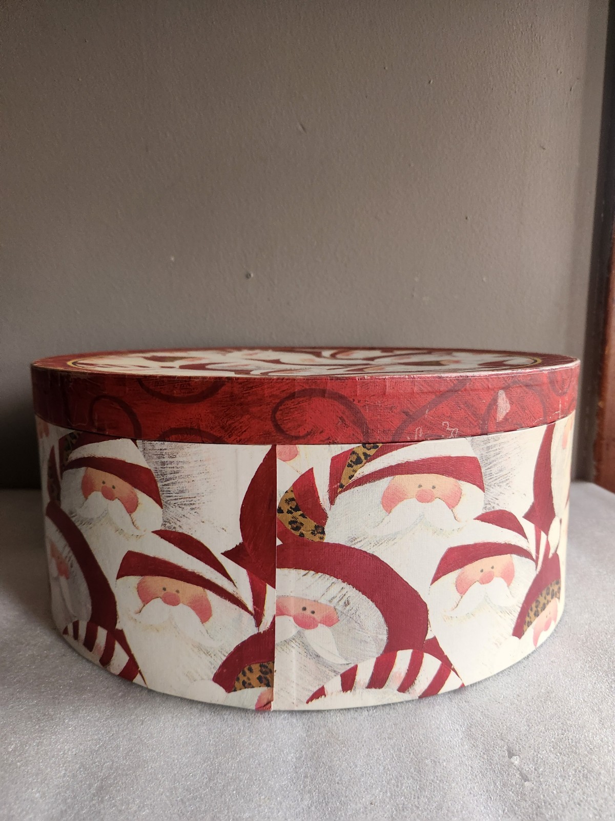 Round Christmas Hat Box Santa Pattern by “Hobby Lobby” 2012 Item# CNB-17 15″×6⅜”
