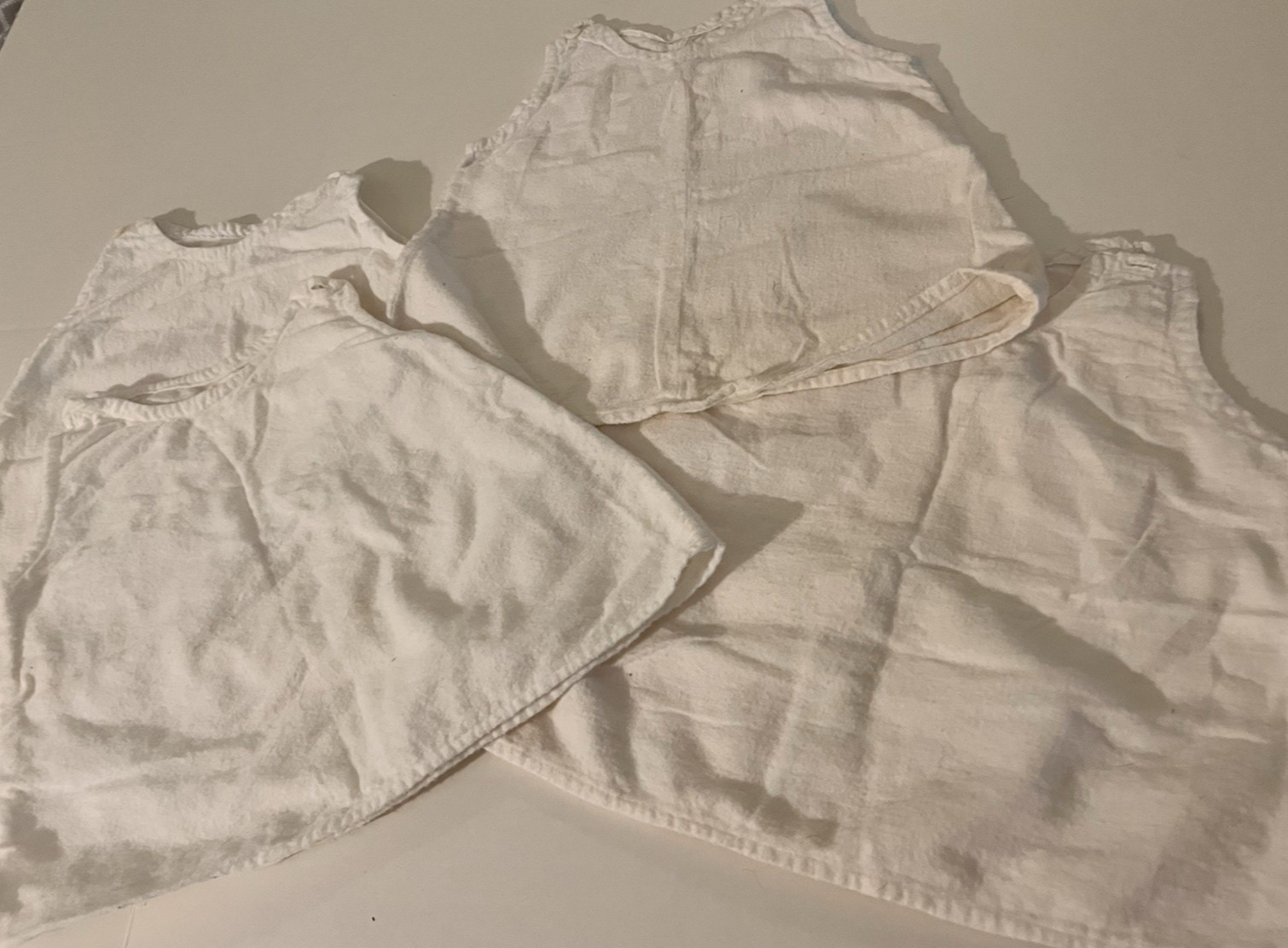 4 Vintage White to Off White Baby or Doll Flannel Slips, Buttons at Shoulders